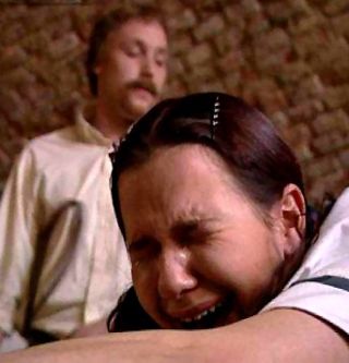 crying girl getting a belt spanking