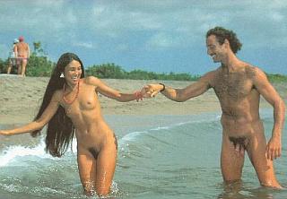 Nude hippies in love and frolicking at the beach