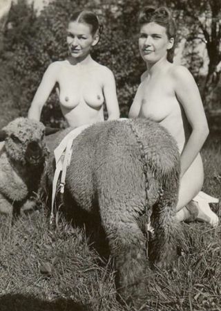 two nude women and a sheep on a chain