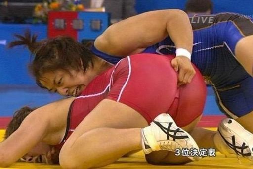 amateur wrestler in Asia grabbing another with some probing fingers right up in the butt
