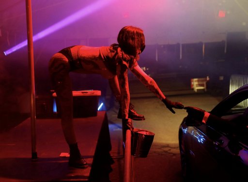 drive through pandemic stripper collects a tip
