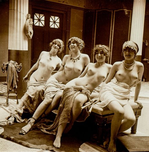 four nude bacchus worshippers on a bench