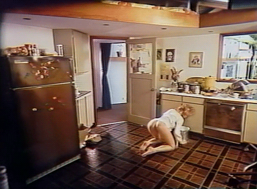 wife with bare bottom scrubs a kitchen floor