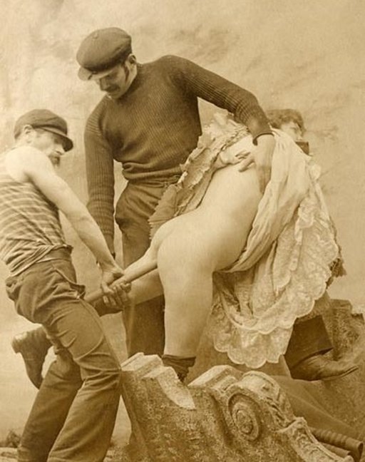 two ruffians inserting a long stick or tube in a woman's butt