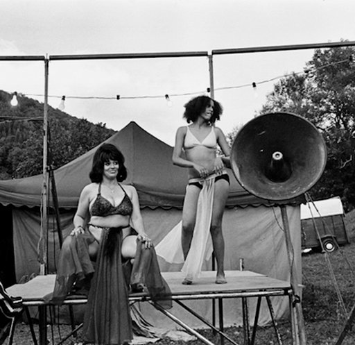 striptease dancers at an outdoor travelling carnival