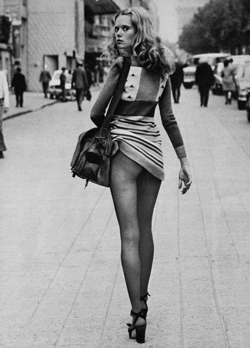 fancy model with no panties glaring at the photographer on a Paris street