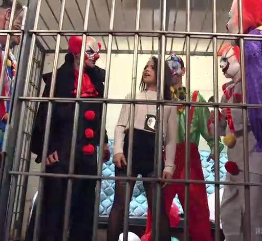 a cage full of creepy clowns and one hot jailer with a clown fetish