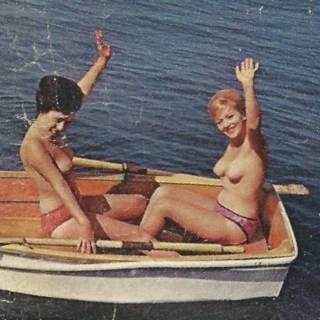 two nudes in a rowboat