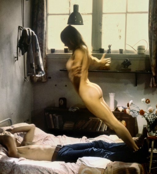 naked woman jumping onto a man on a bed in order to fuck him senseless in a dutch movie