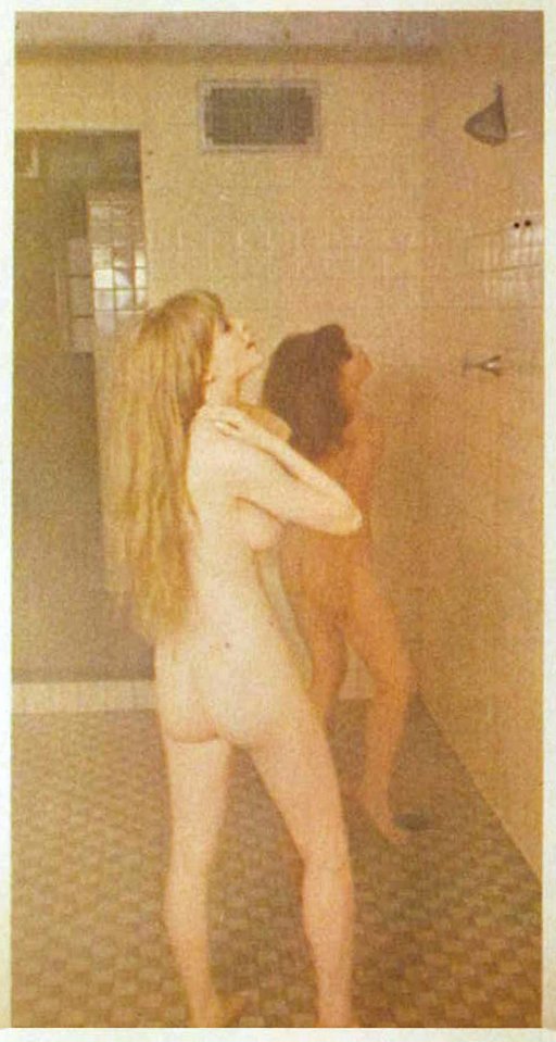 two girls shower in a locker room
