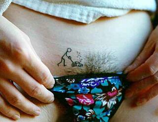 tattoo stick figure with lawnmower shaves her pubic hair