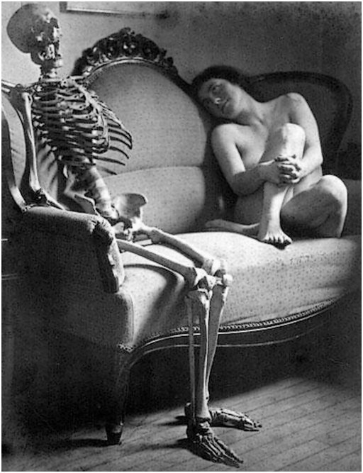 nude and skeleton on couch