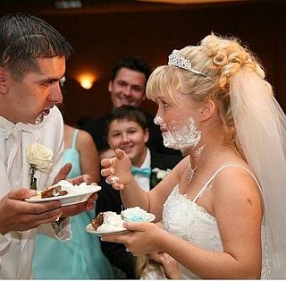 newlywed fun with cake frosting