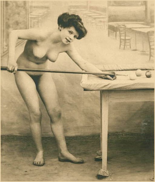 pretty nude woman playing naked pool or billiards