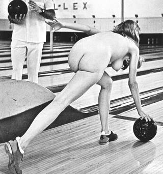 nude girl throwing a bowling ball