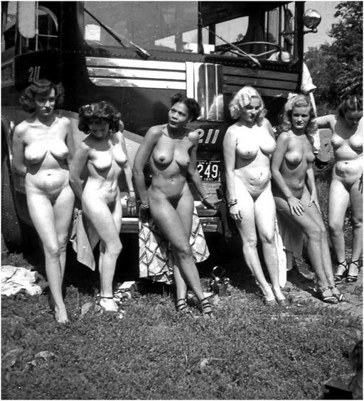 six nude women in front of a bus 1950s
