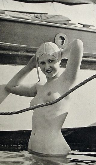 nude bather beside a yacht