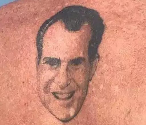 closeup of the Nixon tattoo on Roger Stone between his shoulder blades