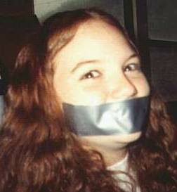 smiling eyes above a duct tape gag