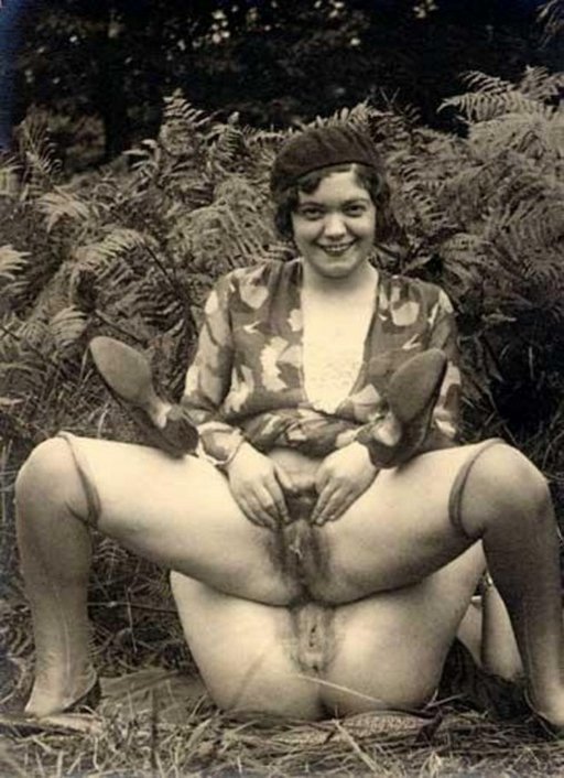 stacked pussies behind a hedge of ferns