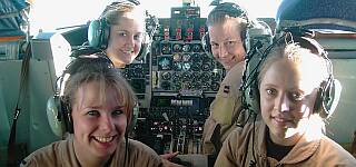 Beautiful young ladies crewing a KC-130 mid-air refueling tanker