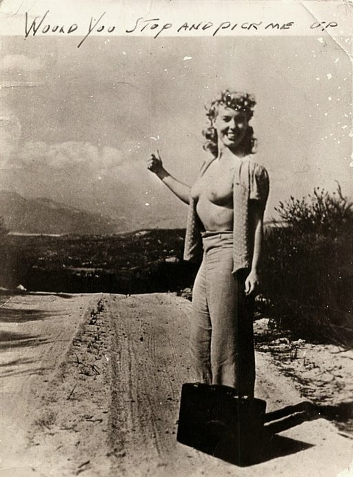 topless hitchhiker waiting for a ride