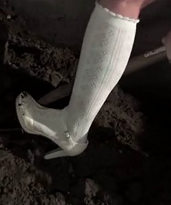 naked slave girl digging dirt in pretty white high heels and socks