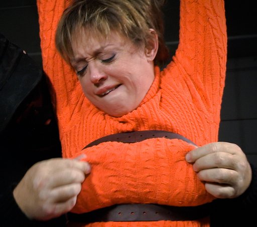 pinching Velma's nipples through her sweater