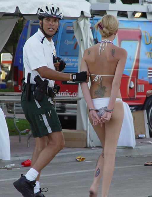 arrested woman in a bikini