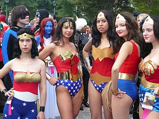 five women in Wonder Woman outfits