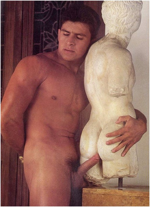naked man hugging a white marble statue and holding the tip of his cock between the stone butt cheeks.