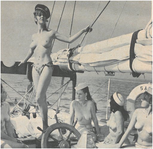 five women five topless girls on a sailboat wearing silly nautical hats