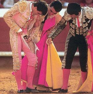 matador counting his balls after a close encounter with bull