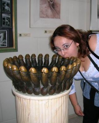 girl with bronze penis in her mouth