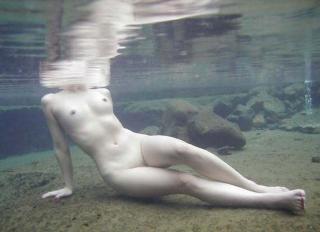 nude woman mostly underwater