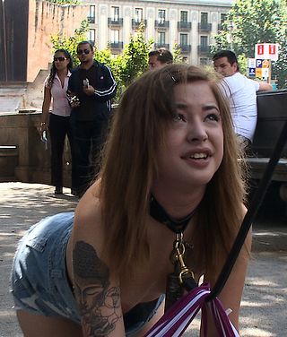 Dulce Mariposa stripped of her shirt and leashed in public