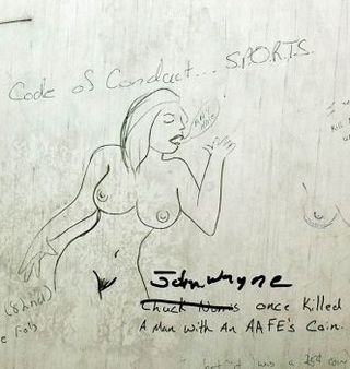 naked lady on a latrine wall
