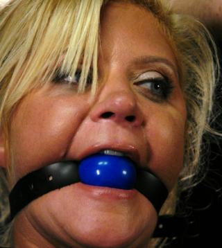 ginger lynn wearing a bondage ball gag