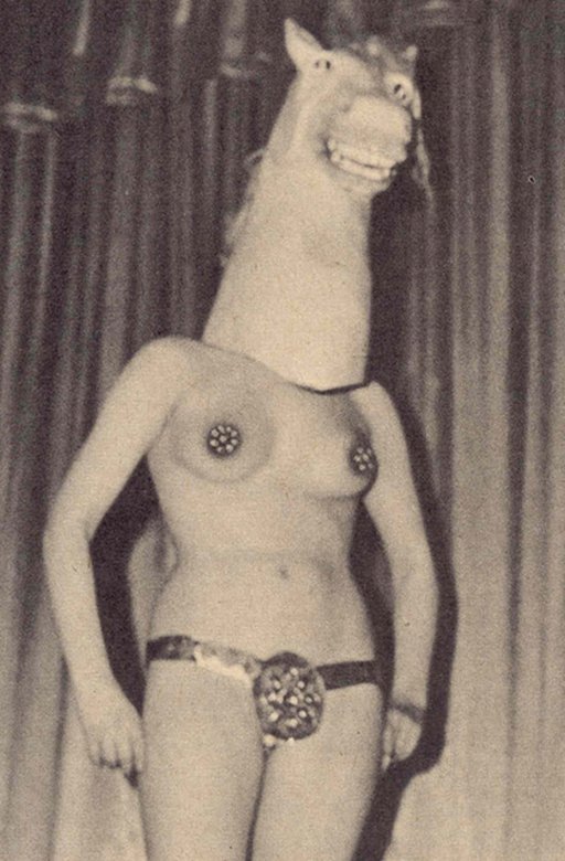 stripping wearing a Jar Jar Binks mask or possibly a terrifying horse head