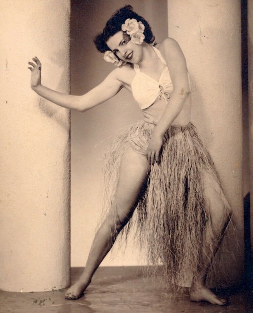 showgirl dancing in a grass skirt