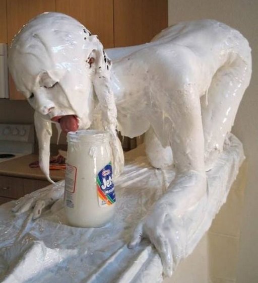 naked girl with her whole nude body coated in marshmallow fluff