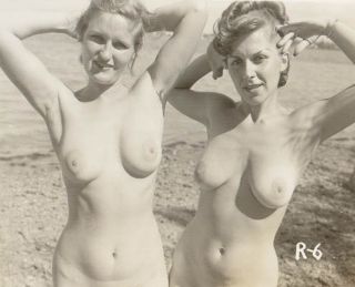 pretty nude sunbathers, perhaps mother and daughter
