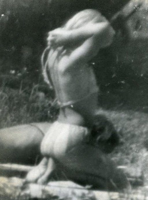Miroslav TichÃ½ kneeling bikini babe