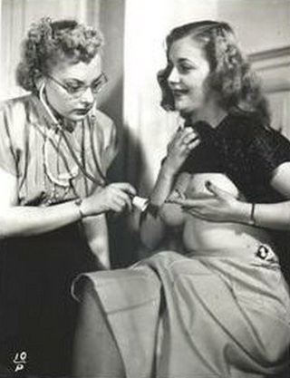patient playing doctor holds her shirt up and cups her breasts with her other hand while doctor extends stethoscope