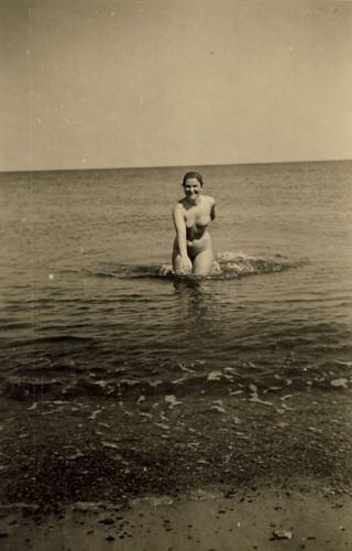 vintage Venus rising from the waves with a smile on her face