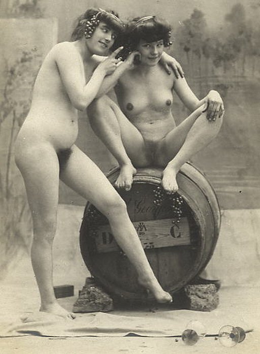 two naked women and a keg of wine