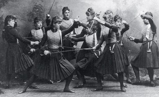 female fencers posing with swords