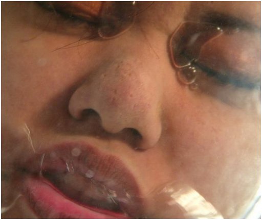 Annie Cruz trying to hold her breath with her face in the toilet bowl