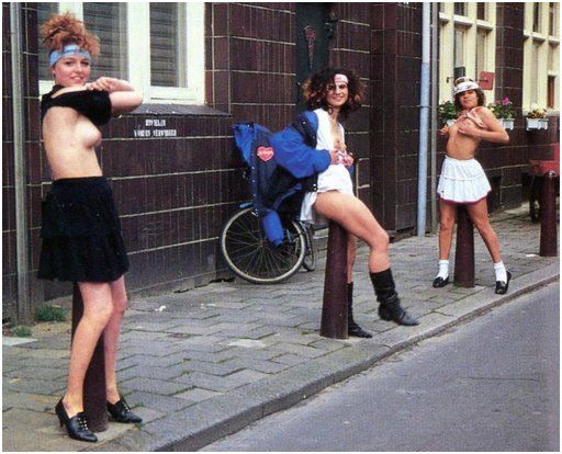 three women rub all over metal bollards