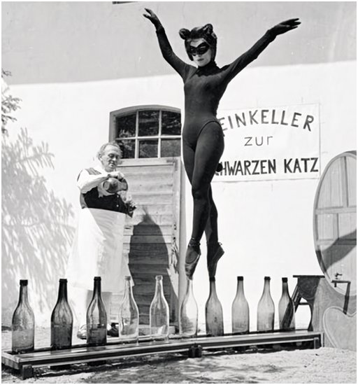 ballet cat girl en pointe on empty wine bottles fetish fuel photograph